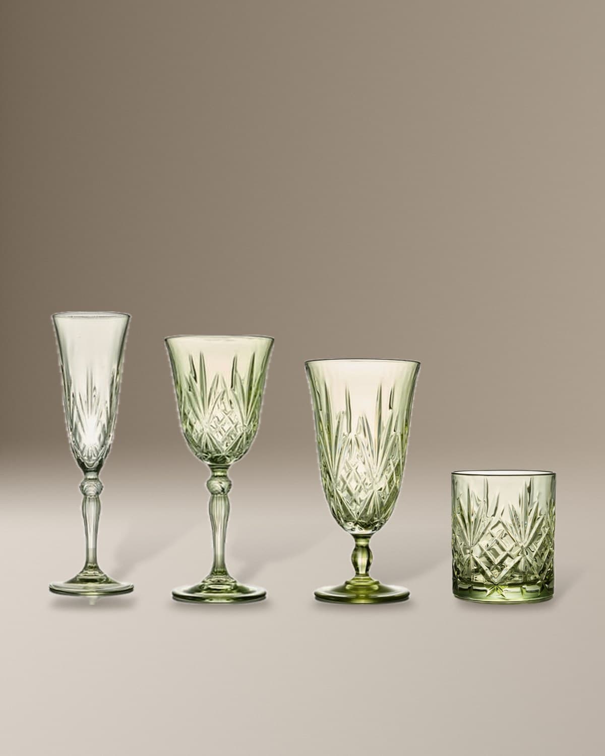 The Melodia Moss Green collection: Crystal Moss Wine Glass, Crystal Moss Water Goblet, Crystal Moss Champagne Flute, Crystal Moss Old Fashioned Glass