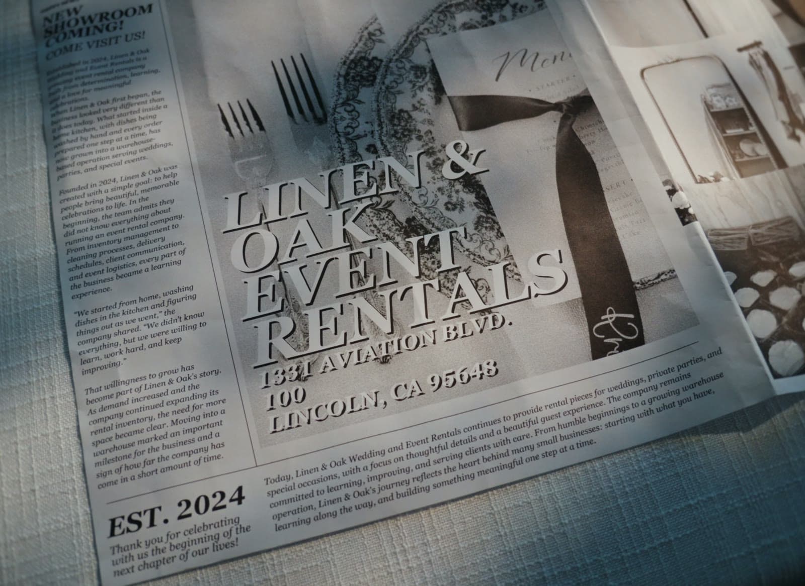 A newspaper clipping announcing Linen & Oak Event Rentals, established 2024, with the Lincoln showroom's address